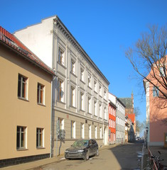 Fototapeta na wymiar Martin-Luther-Strasse in Greifswald, with several historic houses