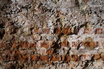 Mur de briques rouges abimées