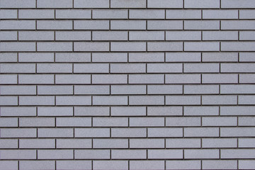 Modern gray brick wall background for building decoration.