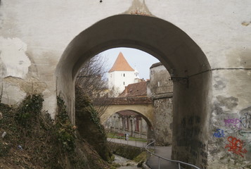 A defense tower seen through one of the arched gates of the Graft Bastion, Romania, Transylvania, Brasov (Bastionul Graft) 1515- 1521