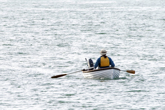 Person rowing in San Francisco Bay. Rowing. Rowing just might be the most efficient exercise.