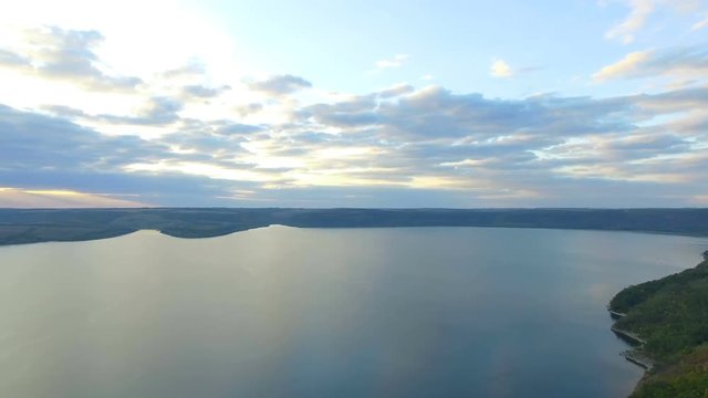Great sunset on the lake. Magnificent vacation, wonderful sunsets between mountains lakes and rivers. 4k