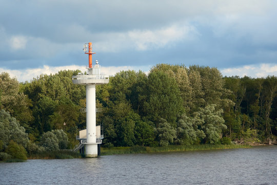 Navigational tower on the water for ships in summer weather