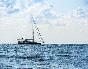 Fototapeta premium Sailing yacht in the open Sea. Blue water.