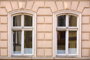 Fototapeta na wymiar Ornaments and windows on a historic house from 1886 in Greifswald, Germany