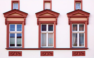 Obraz premium Ornaments and windows on a historic house from 1888 in Greifswald, Germany