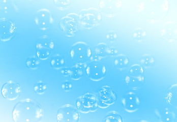Abstract Blue soap bubbles float background