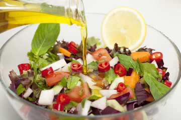 olive oil with salad bowl