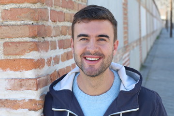 Gorgeous green eyed smiling man outdoors