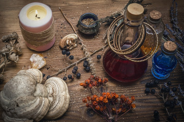 Magic potion. Alternative herbal medicine. Shaman table with copy space. Druidism concept. Witch...