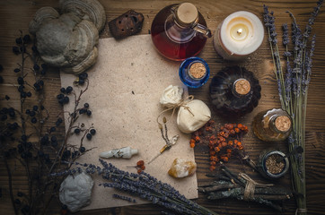 Magic potion ancient recipe scroll with copy space. Alternative herbal medicine. Shaman table with copy space. Druidism concept. Witch doctor desk background.