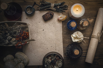 Magic potion ancient recipe scroll with copy space. Alternative herbal medicine. Shaman table with...