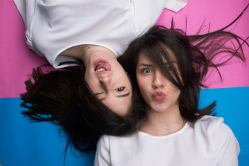 two young beautiful girls have a fun isolated