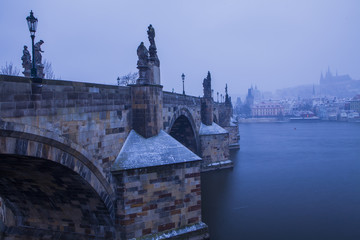 Obraz premium Winter cityscape, snowing in Prague, Czech Republic 