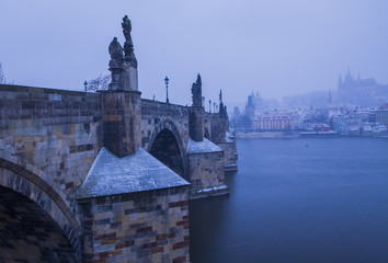 Fototapeta premium Winter cityscape, snowing in Prague, Czech Republic 