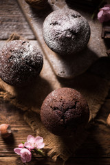 Chocolate muffin. Homemade bakery on wooden background