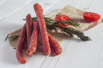Italian hunting dry long sausages close