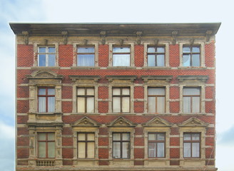 Fototapeta na wymiar Desolate facade of a house listed as monument in Magdeburg