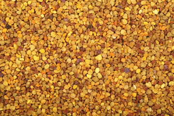 fresh bee pollen as a background. Top view. Flat lay