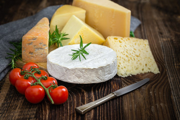 Cheeses with basil, rosemary and tomatoes.
