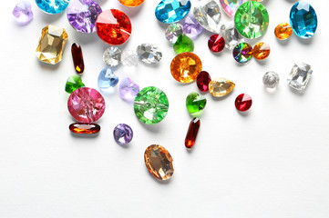Colorful precious stones for jewellery on white background