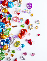 Colorful precious stones for jewellery on white background