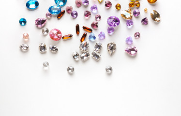 Colorful precious stones for jewellery on white background
