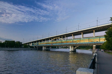 Metro bridge over the river at dusk