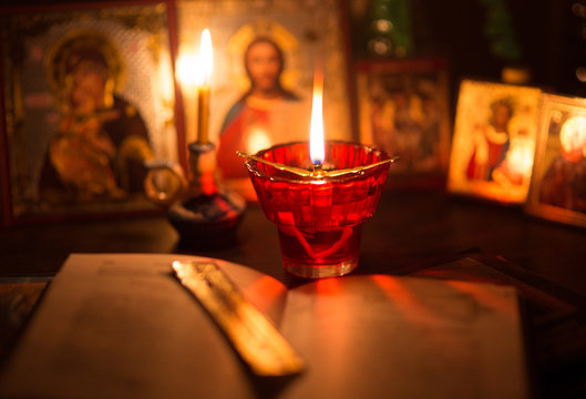 Burning lamp with orthodox icons
