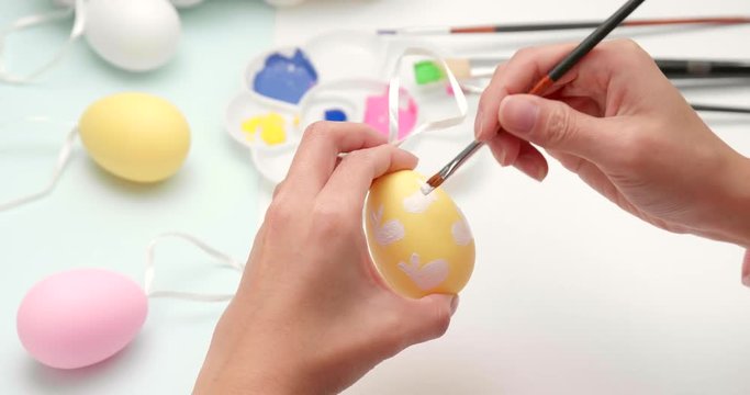 Painting colorful Easter egg
