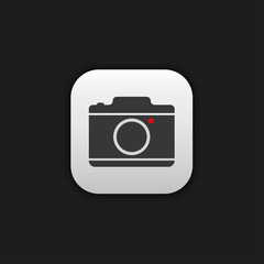 A flat camera icon in a gray frame on a black background