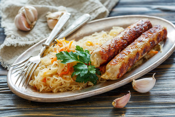 Stewed sour cabbage with sausages.