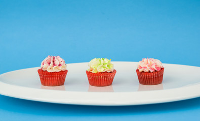 delicious pastries, cupcakes on a white plate