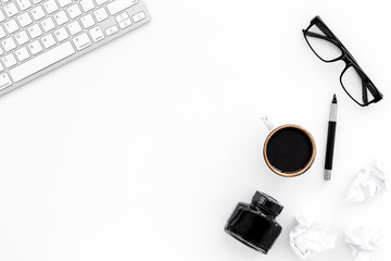 writer office desk with keyboard, ink, pen and glasses white background top view space for text