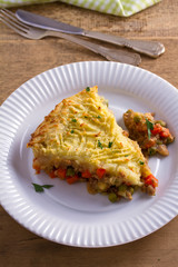 Traditional shepherd pie - popular dish in Ireland. Beef meat, mashed potato, cheese, carrot, onion and green peas casserole