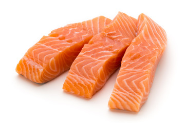 Fresh salmon fillet with basil on the white background.