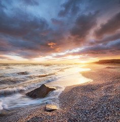 Sea shore during sunrise. Beautiful natural seascape
