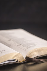 Open Bible on a Slate Tabletop with Customizable Space to Add Text © pamela_d_mcadams
