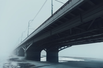 Chernavsky bridge in fog in Voronezh, perspective, blue toned