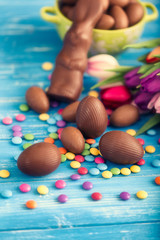 Fototapeta na wymiar chocolate easter eggs and tulips