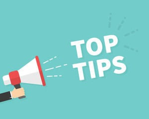 Male hand holding megaphone with Top Tips speech bubble. Loudspeaker. Banner for business, marketing and advertising. Vector illustration.