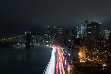 Fototapeta na wymiar Foggy Night on Manhattan Bridge