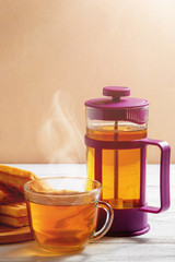 Homemade Waffles with Jam on Old Wooden Table. Wafers with Cup of Tea and Teapot.