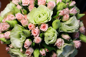 Delicate bouquet of the bride, roses and oustoms