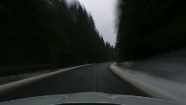Time lapse of the movement on the car on the road through national park Harz in the winter. Lower Saxony. Germany. 4K