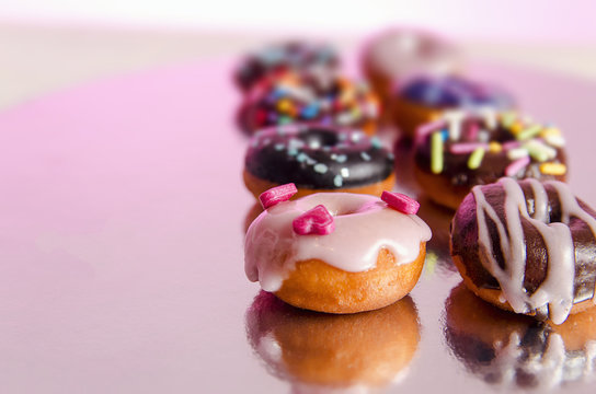 Bunch of different miniature / mini donuts beautifully decorated 