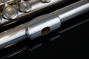 Naklejka premium Close up of the silver plated musical instrument flute