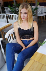 A beautiful blond girl in cafe