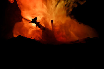 Air Crash. Burning falling helicopter. Destroyed helicopter. Decorated with toy at dark fire background. © zef art