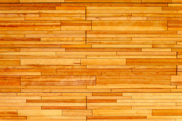 Wooden wall made of rectangular pieces of light wood